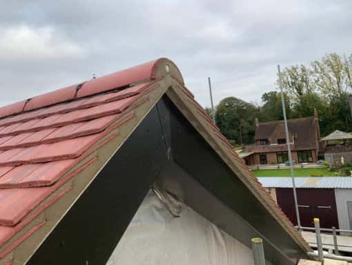 This is a photo of a gable end roof just repaired in Ashford Kent. All works carried out by Ashford Roofing Services based in KENT